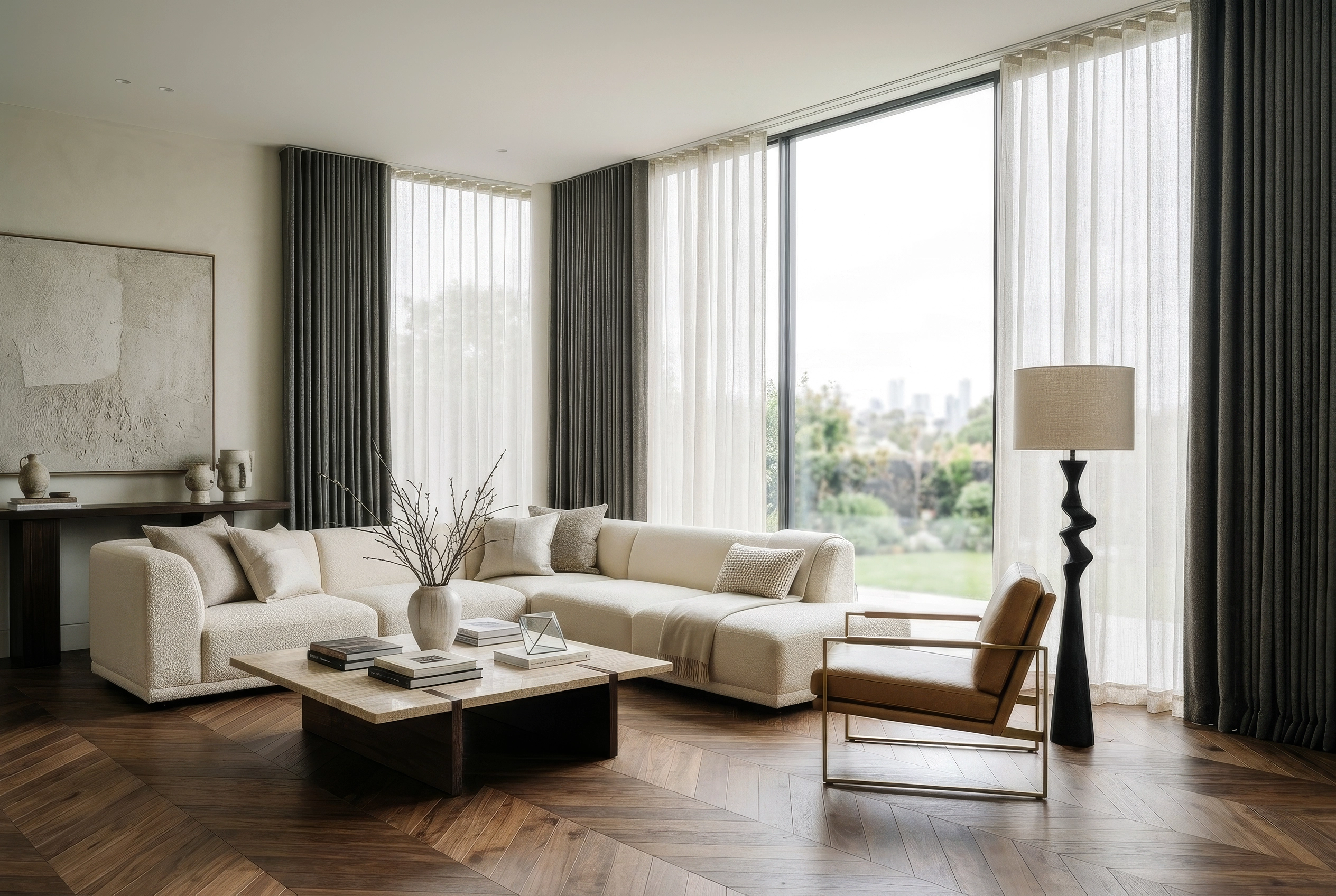 Modern living room with sheer and dark drapes showcasing elegant curtain fabrics in a contemporary interior design.